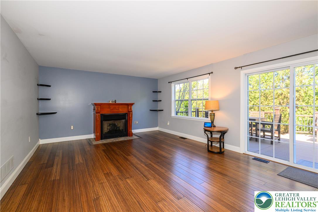 1252 Center Street Coplay, PA 18037 - Photo 15 of 63 a view of empty room with wooden floor and fireplace