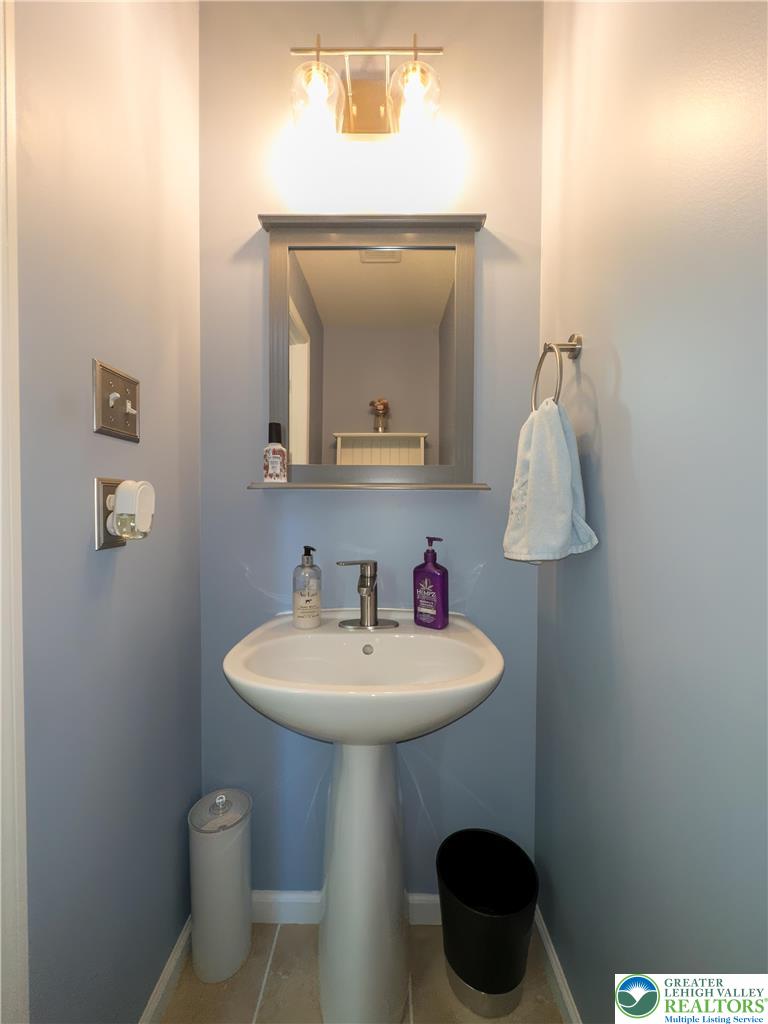 1252 Center Street Coplay, PA 18037 - Photo 18 of 63 a bathroom with a toilet a sink and mirror