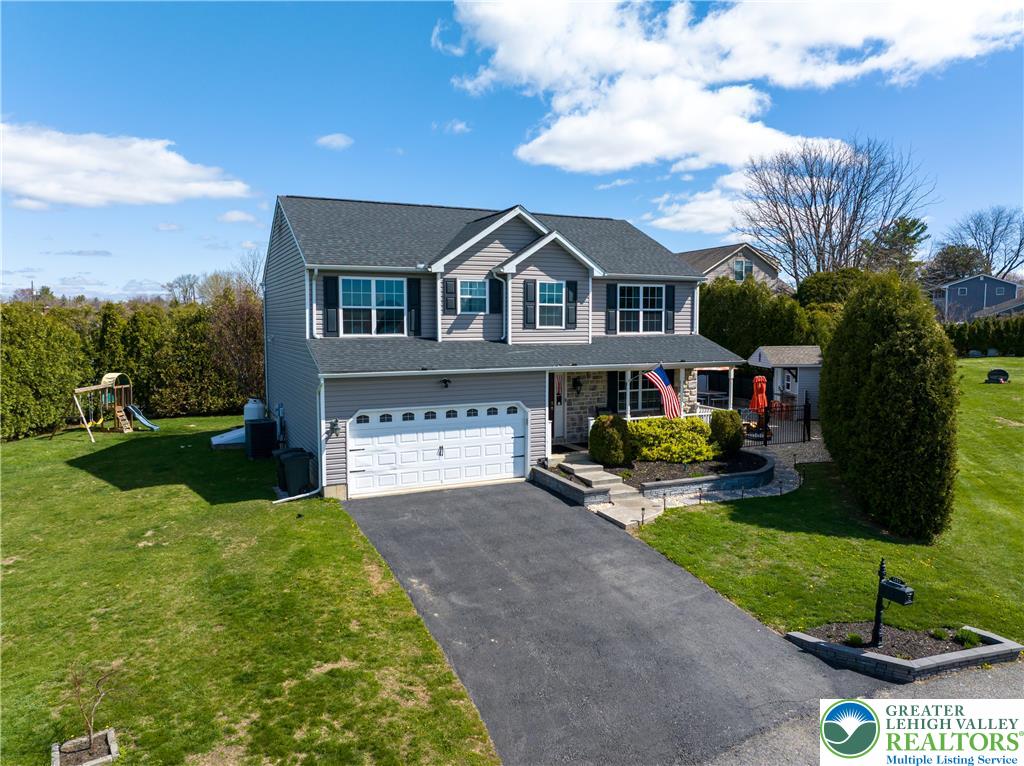 1252 Center Street Coplay, PA 18037 - Photo 2 of 63 a front view of a house with garden