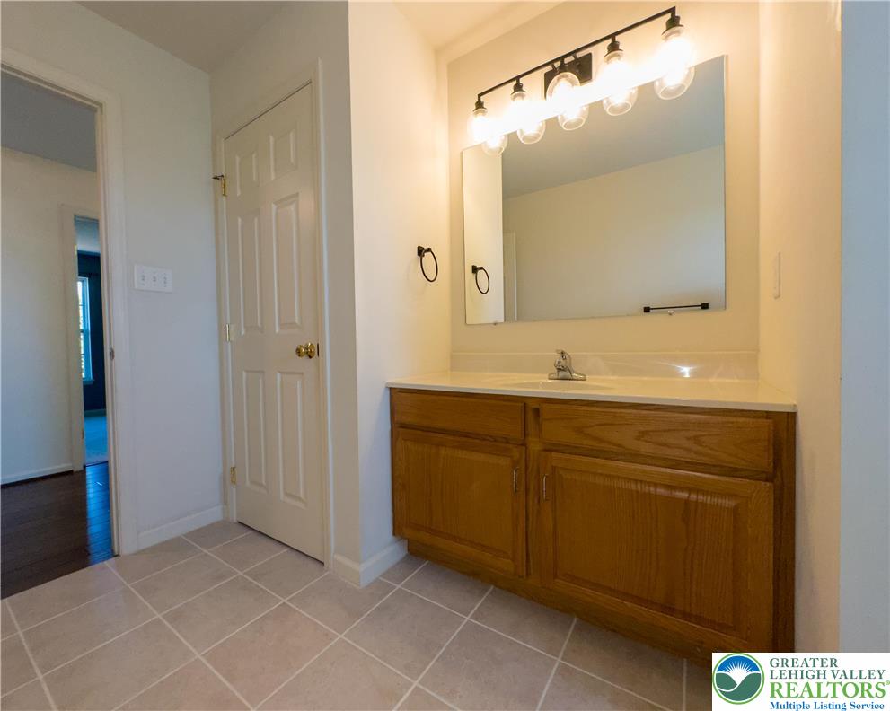 1252 Center Street Coplay, PA 18037 - Photo 28 of 63 a bathroom with a sink and a mirror