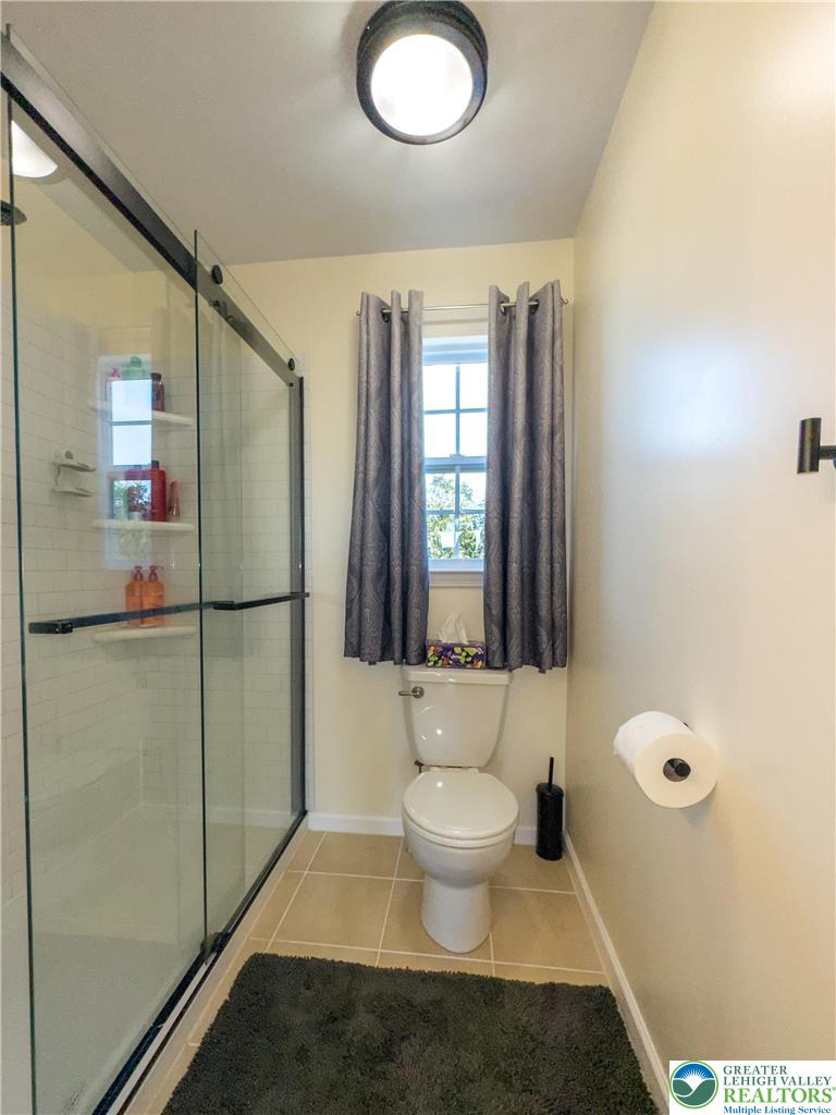 1252 Center Street Coplay, PA 18037 - Photo 35 of 63 a bathroom with a toilet sink and mirror