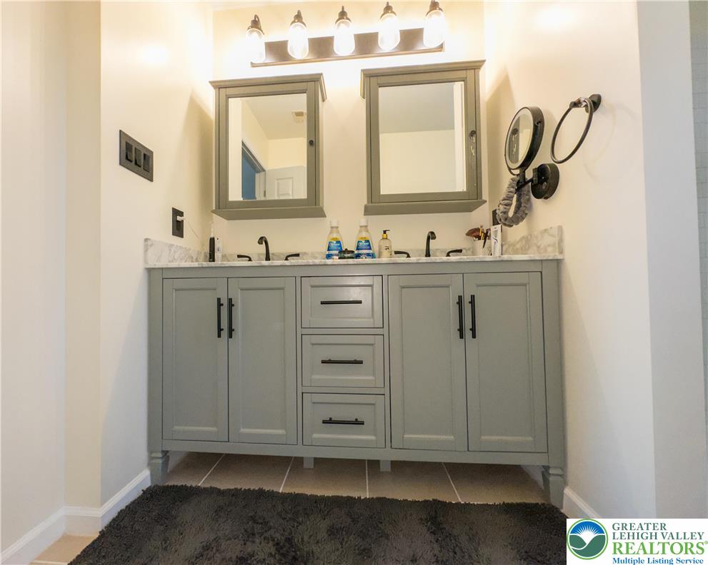 1252 Center Street Coplay, PA 18037 - Photo 37 of 63 a bathroom with a sink a vanity and a mirror
