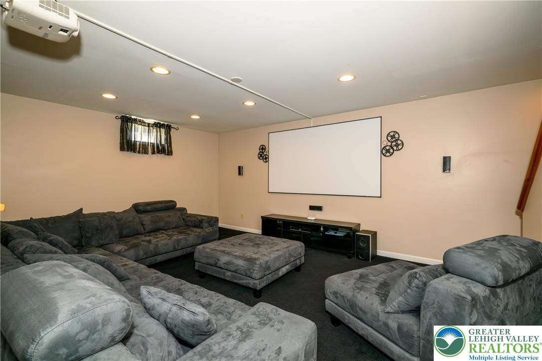 1252 Center Street Coplay, PA 18037 - Photo 40 of 63 a living room with furniture and a flat screen tv