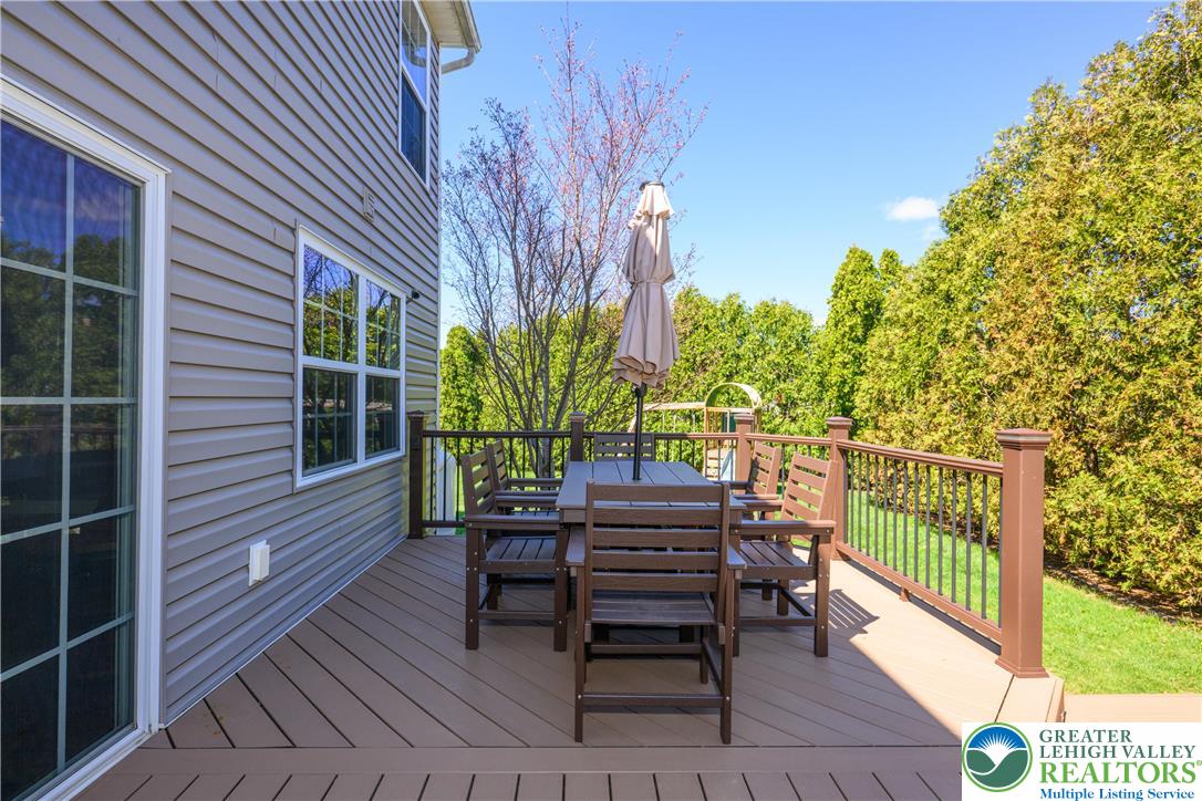 1252 Center Street Coplay, PA 18037 - Photo 47 of 63 a view of a deck with a table and chairs and potted plants