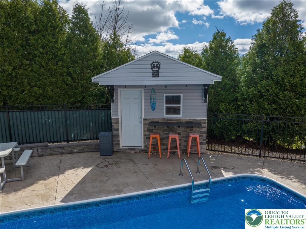 1252 Center Street Coplay, PA 18037 - Photo 52 of 63 a view of a chairs and table in the back yard of the house