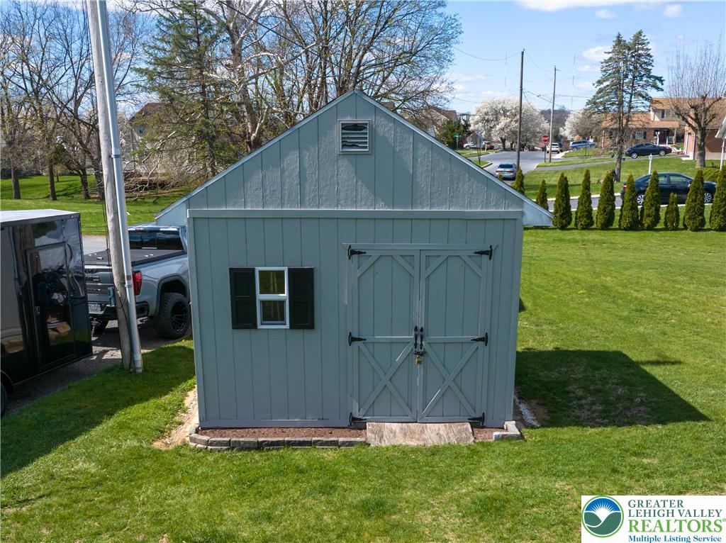 1252 Center Street Coplay, PA 18037 - Photo 57 of 63 a view of backyard with potted plants and large tree