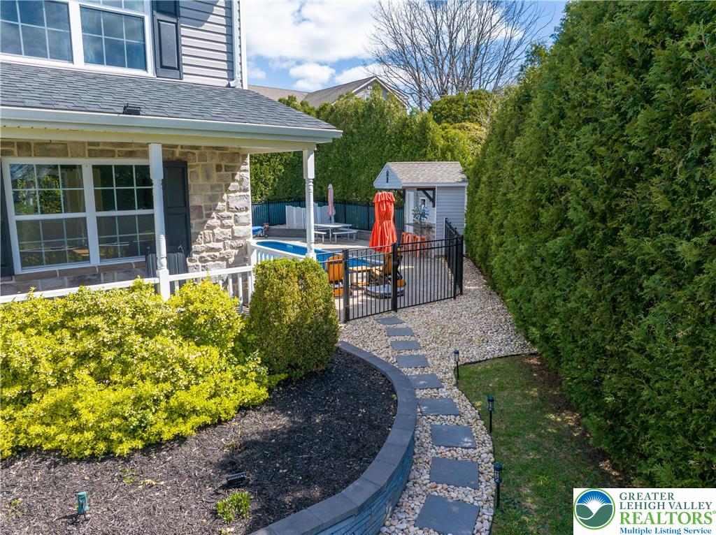 1252 Center Street Coplay, PA 18037 - Photo 61 of 63 a flower garden is sitting in front of a building