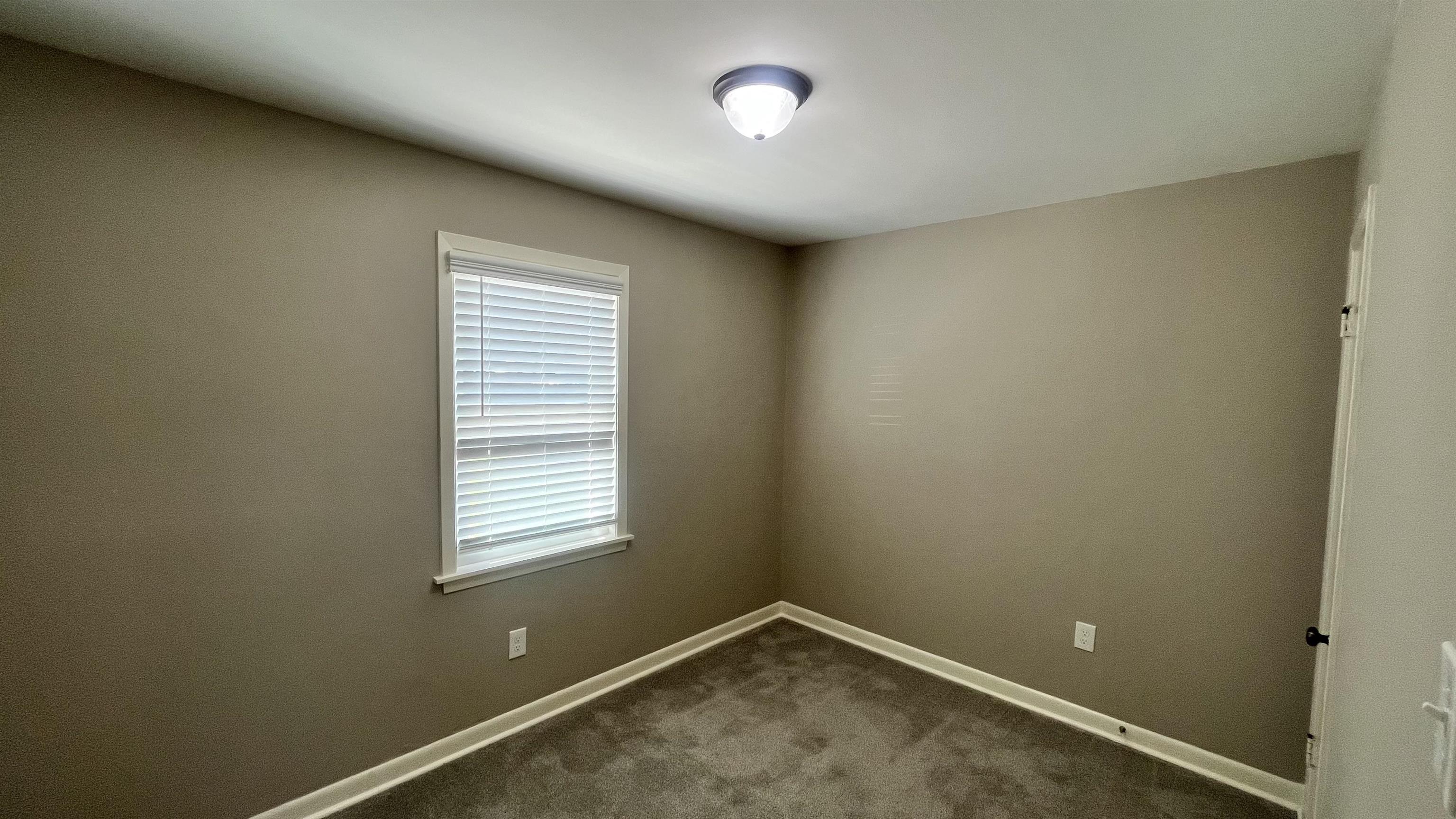121 West Street Collierville, TN 38017 - Photo 5 of 16 an empty room with a window