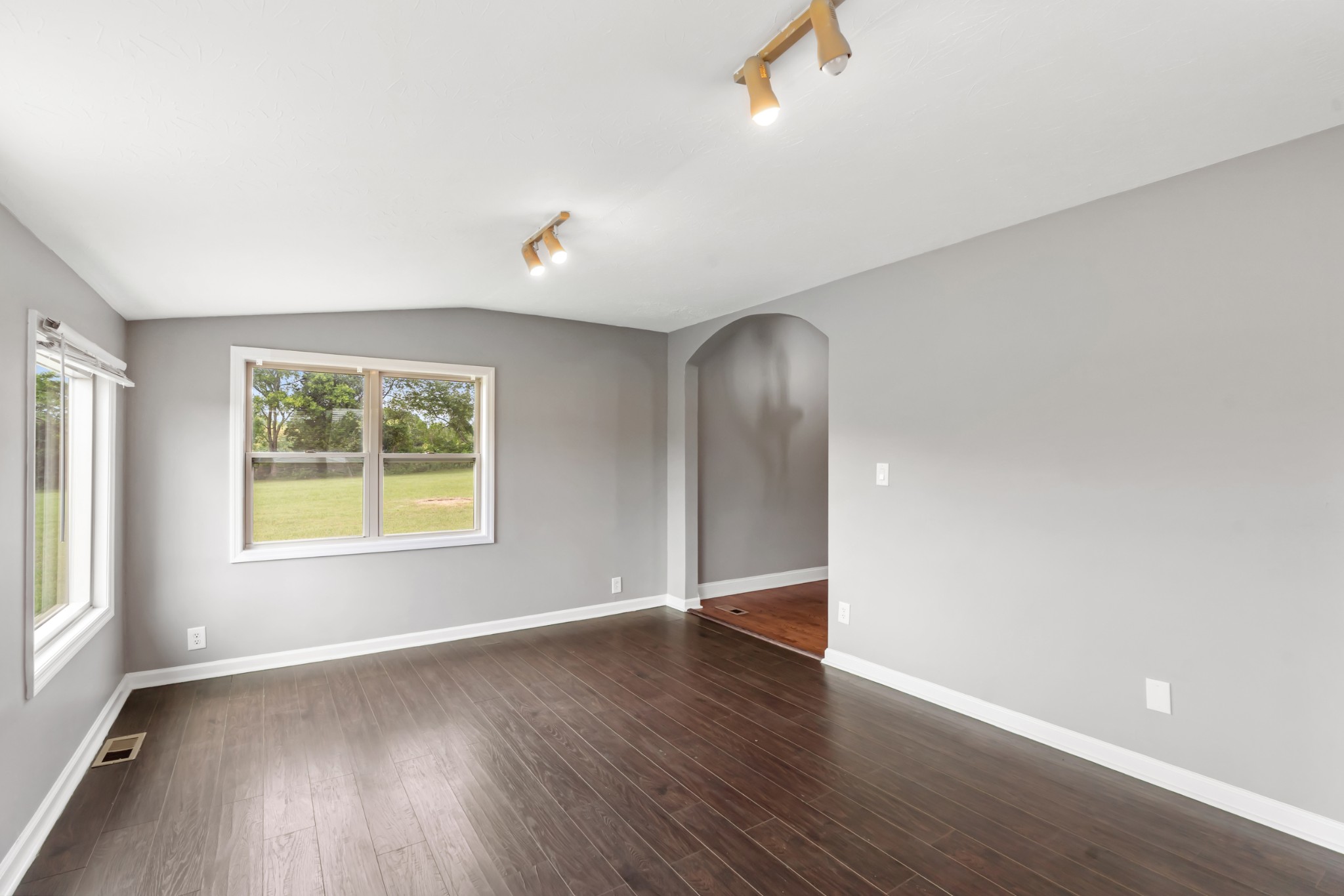 4602 Washington Road Springfield, TN 37172 - Photo 18 of 63 an empty room with wooden floor and windows