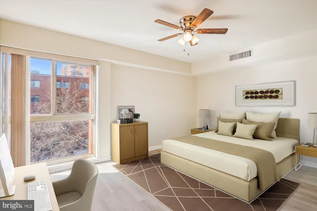 a bedroom with a bed and a couch