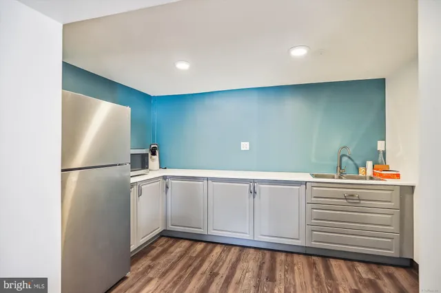 a view of cabinets with wooden floor