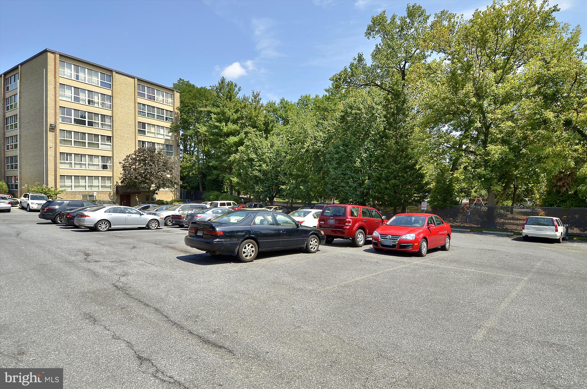 4970 Battery Lane, Unit 408 Bethesda, MD 20814 - Photo 31 of 40 a view of a cars parked in front of a house