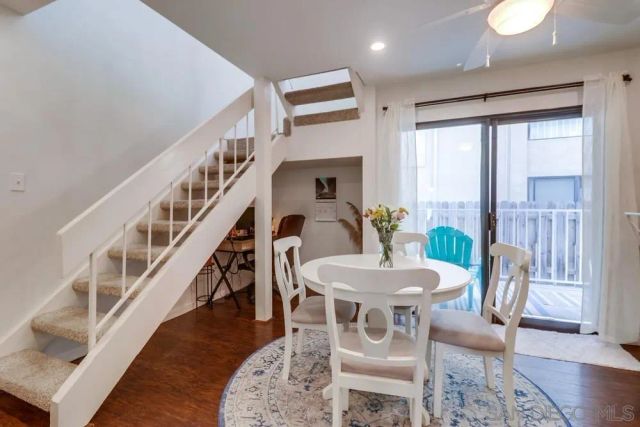 a kitchen with stainless steel appliances granite countertop a refrigerator a stove and a sink