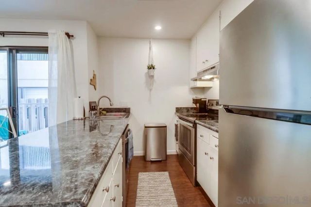 a porch with furniture and flowers