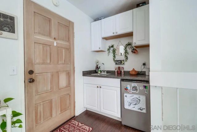 a living room with furniture large window and a flat screen tv