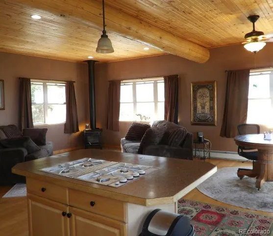 a living room with furniture rug and window