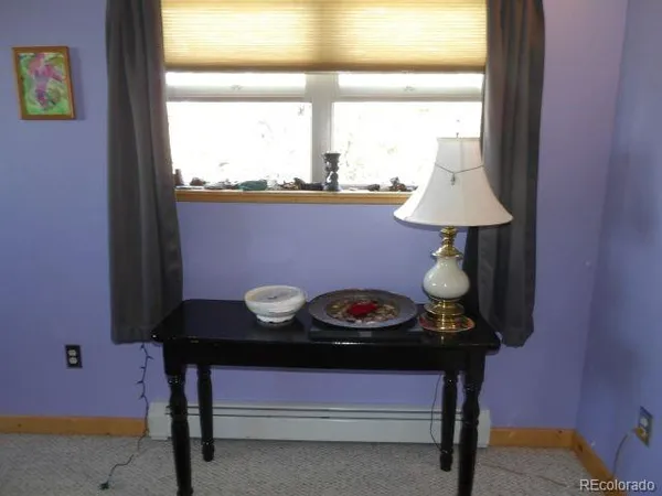 a view of a workspace with furniture