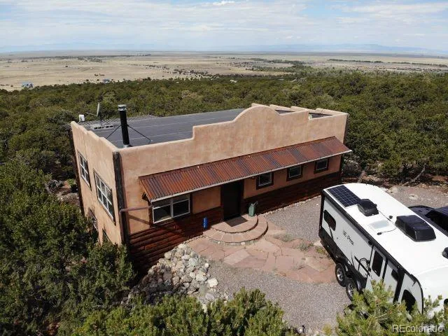 an aerial view of a house with roof deck