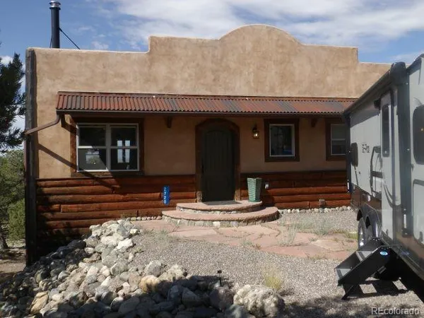 a front view of a house with stairs