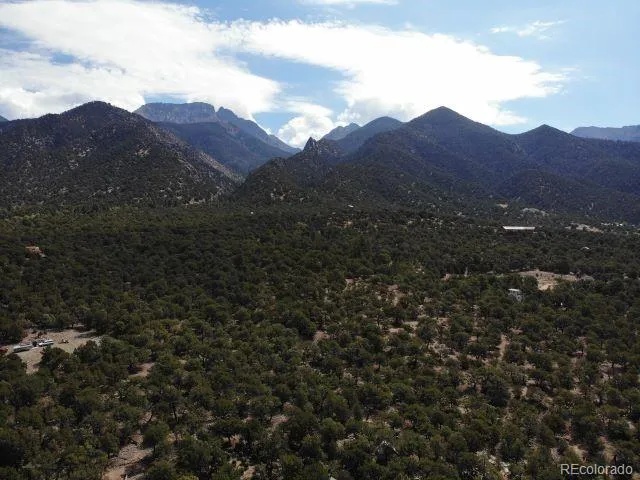 a view of a house with a mountain in the background