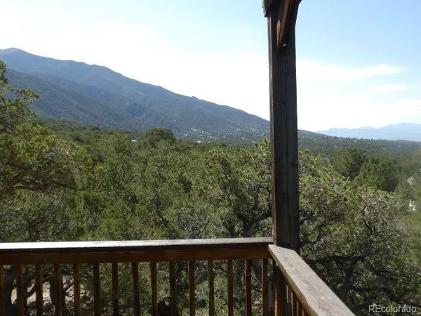 a view of a mountain from a balcony