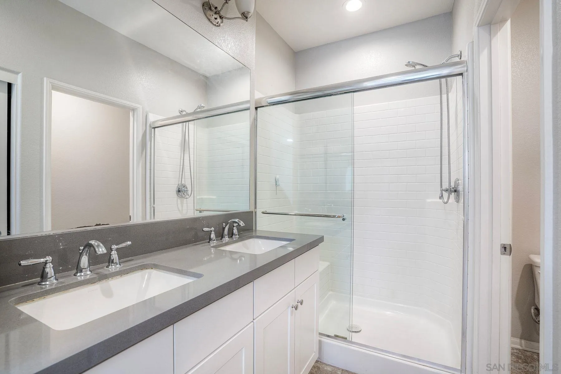 8850 Olive Lane, Unit 7 Santee, CA 92071 - Photo 18 of 27 a bathroom with a granite countertop sink mirror and double