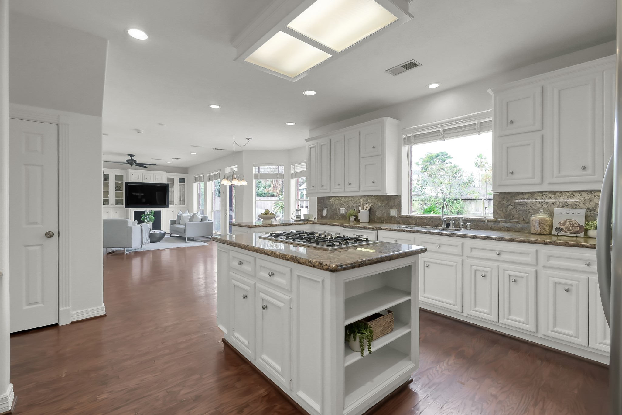 16403 Agusta Court Spring, TX 77379 - Photo 3 of 36 a large kitchen with stainless steel appliances granite countertop a stove and a sink