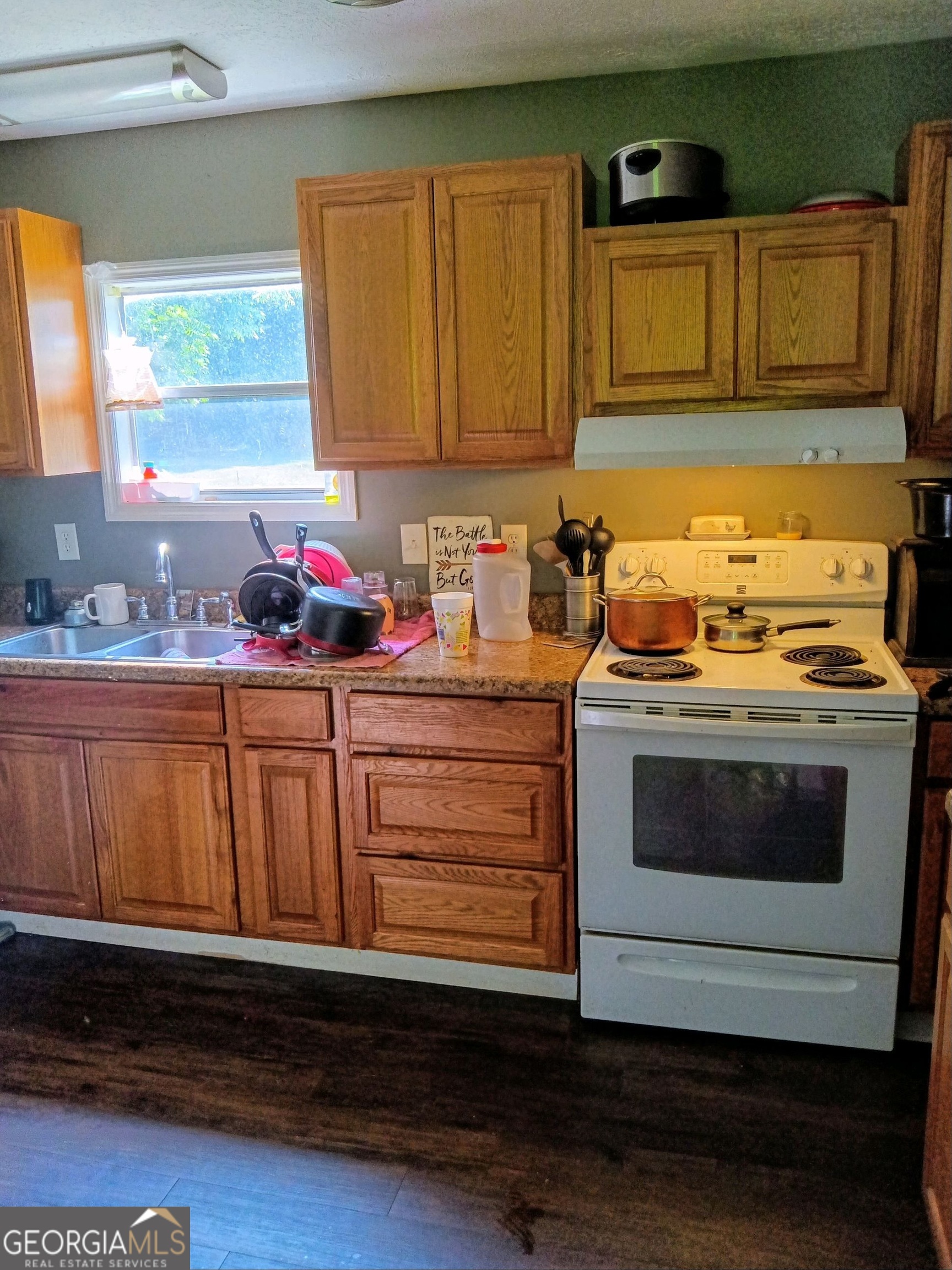 67 Glenloch Road Roopville, GA 30170 - Photo 4 of 11 a kitchen with granite countertop cabinets stainless steel appliances and a sink