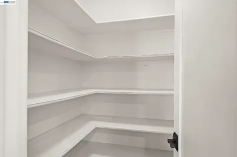 a empty closet with white paint