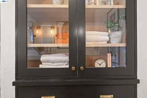 a bathroom with a mirror and vanity