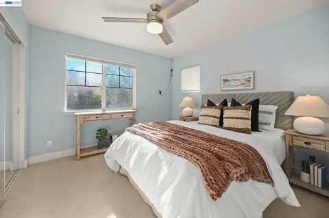 a bedroom with a bed and window