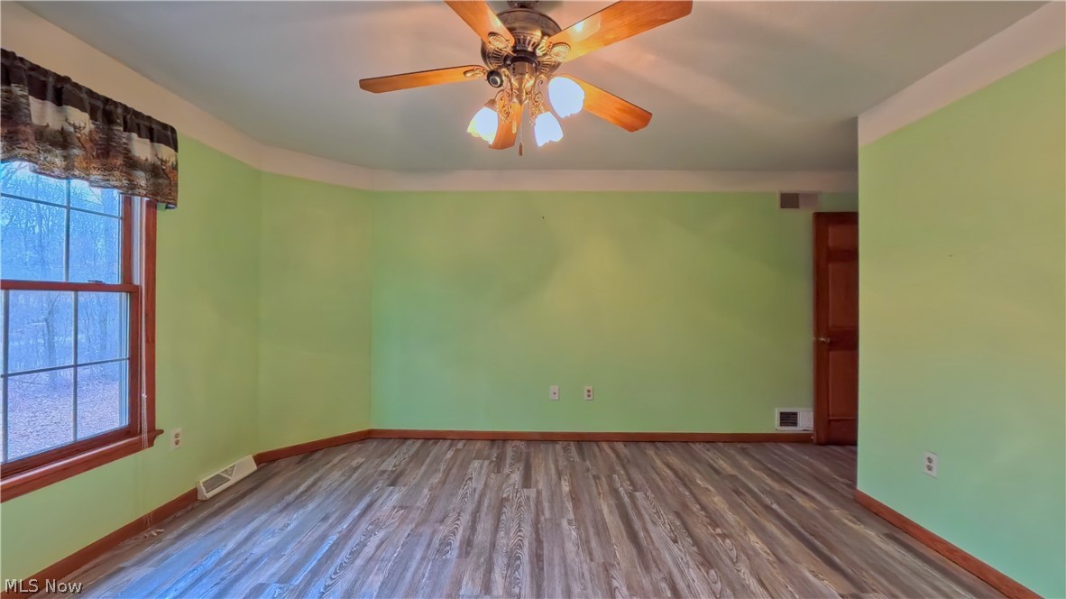 48276 Dyke Road Negley, OH 44441 - Photo 11 of 30 Spare room with dark wood-style flooring and a ceiling fan