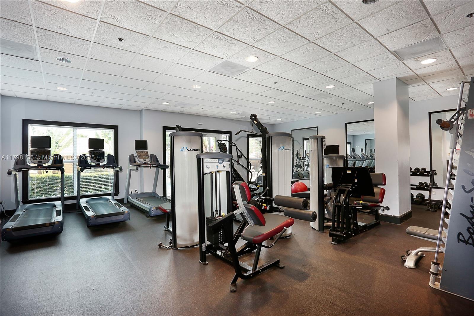 2665 Southwest 37th Avenue, Unit 1506 Miami, FL 33133 - Photo 15 of 19 a view of a room with gym equipment