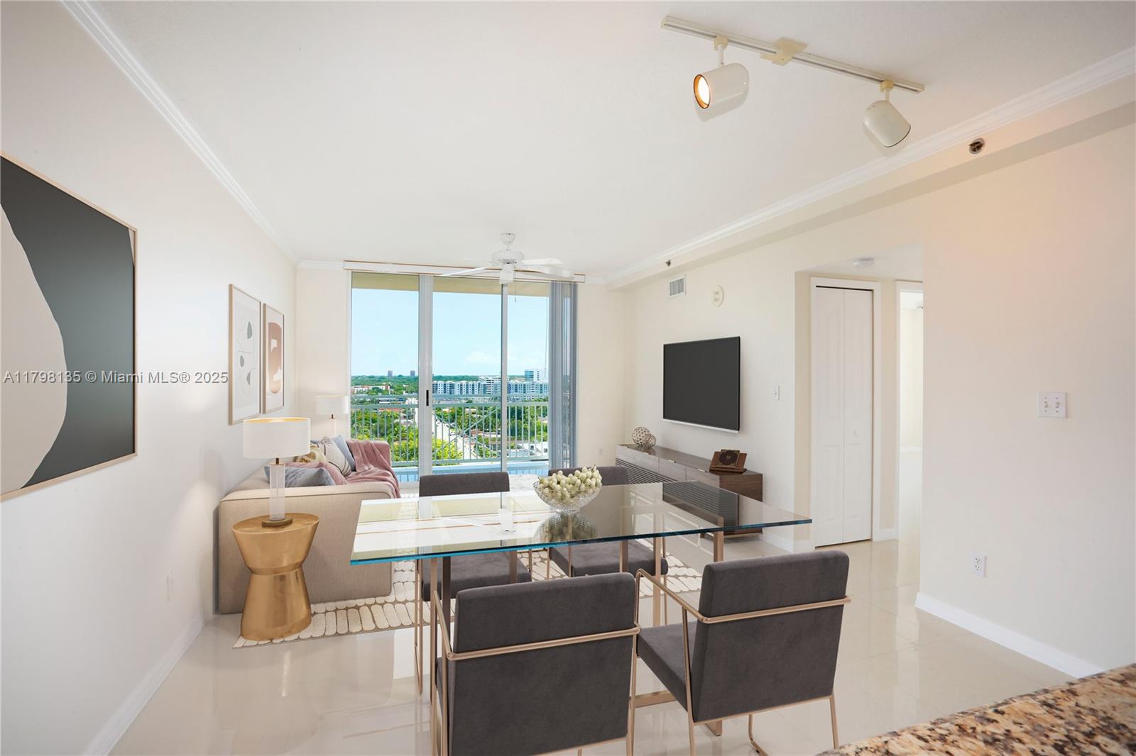 2665 Southwest 37th Avenue, Unit 1506 Miami, FL 33133 - Photo 2 of 19 a living room with furniture and a flat screen tv