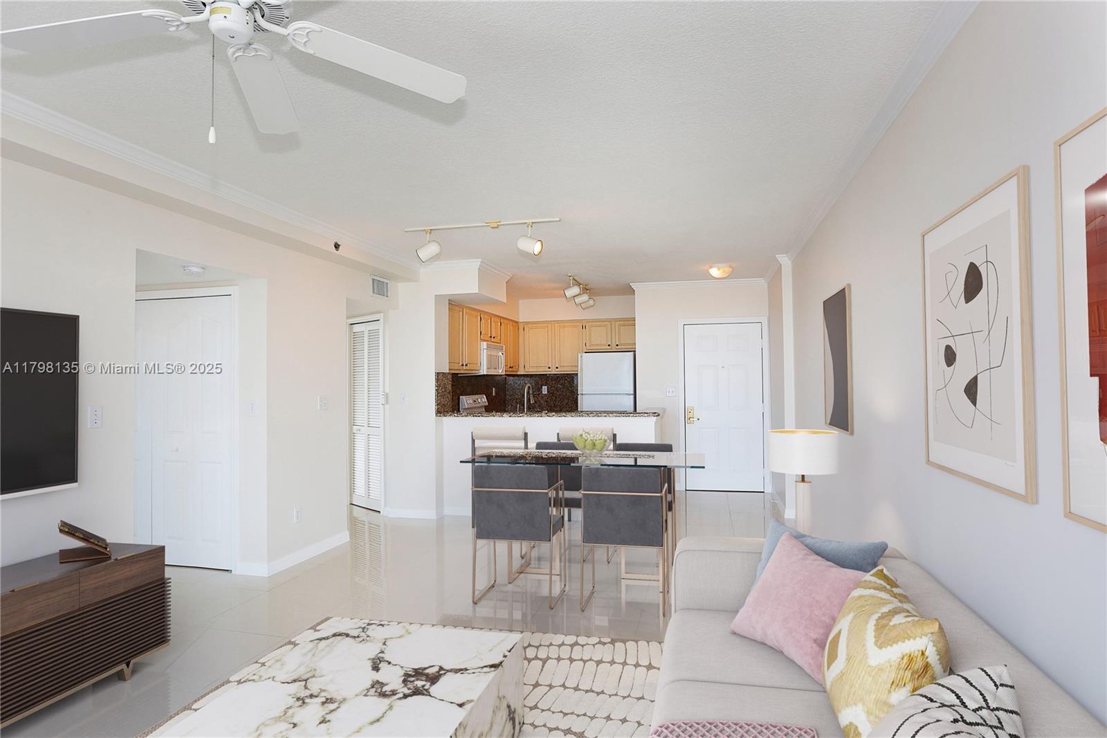 2665 Southwest 37th Avenue, Unit 1506 Miami, FL 33133 - Photo 8 of 19 a living room with stainless steel appliances kitchen island granite countertop furniture and a couch
