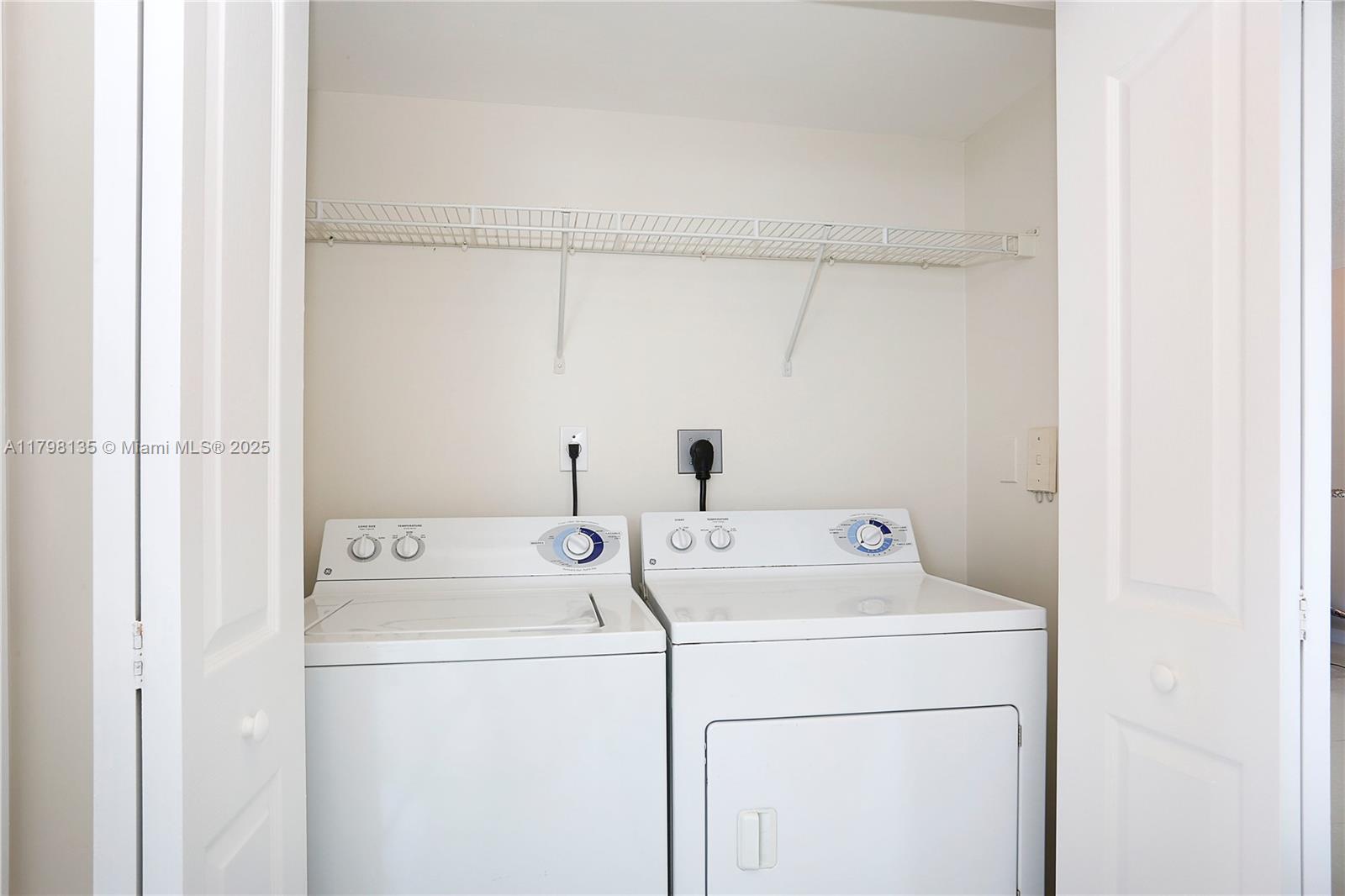 2665 Southwest 37th Avenue, Unit 1506 Miami, FL 33133 - Photo 9 of 19 a utility room with dryer and washer