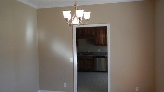 1205 East End Road Manchester, TN 37355 - Photo 4 of 14 The formal dining room has hardwood floors, crown molding, and neutral paint.