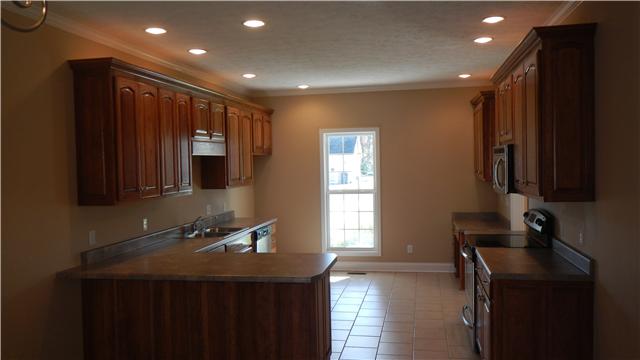 1205 East End Road Manchester, TN 37355 - Photo 5 of 14 Large, open kitchen with lots of counter space and cabinet storage. Recessed lighting, ceramic tile floors, and appliances.