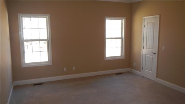 1205 East End Road Manchester, TN 37355 - Photo 8 of 14 One of three bedrooms with large closets, neutral paint, and carpet. Great size!