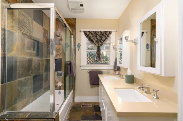 a en suite bathroom with a sink and a mirror