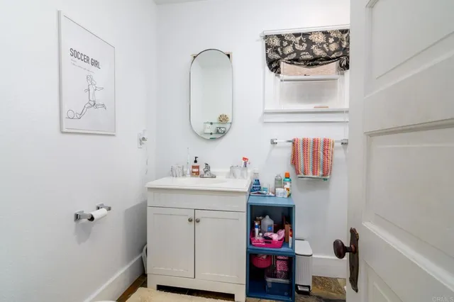 a utility room with a sink and a window