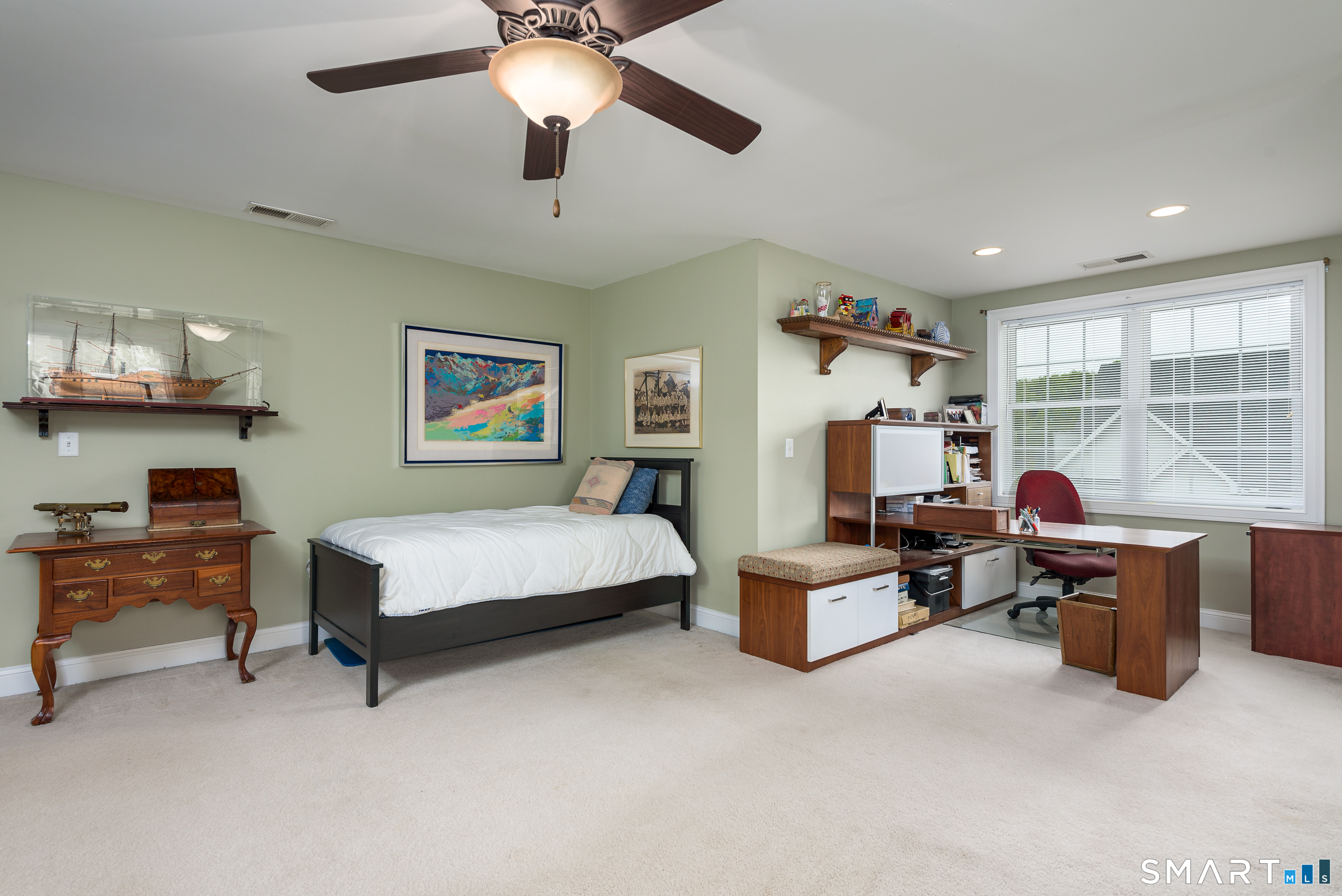8 Greendale Drive, Unit 8 Suffield, CT 06078 - Photo 32 of 40 a bedroom with a bed and furniture