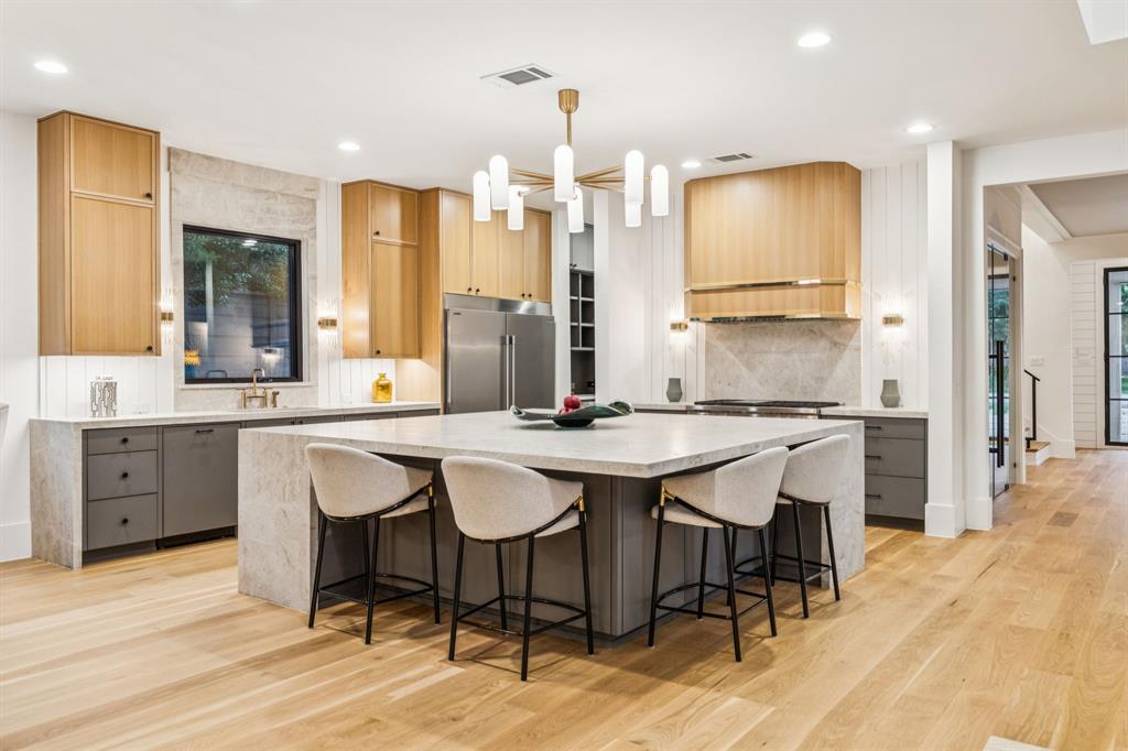 4330 Ridge Road Dallas, TX 75229 - Photo 11 of 30 a large kitchen with lots of counter space and chairs