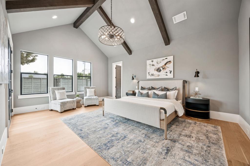 4330 Ridge Road Dallas, TX 75229 - Photo 15 of 30 a spacious bedroom with a bed a couch and large window