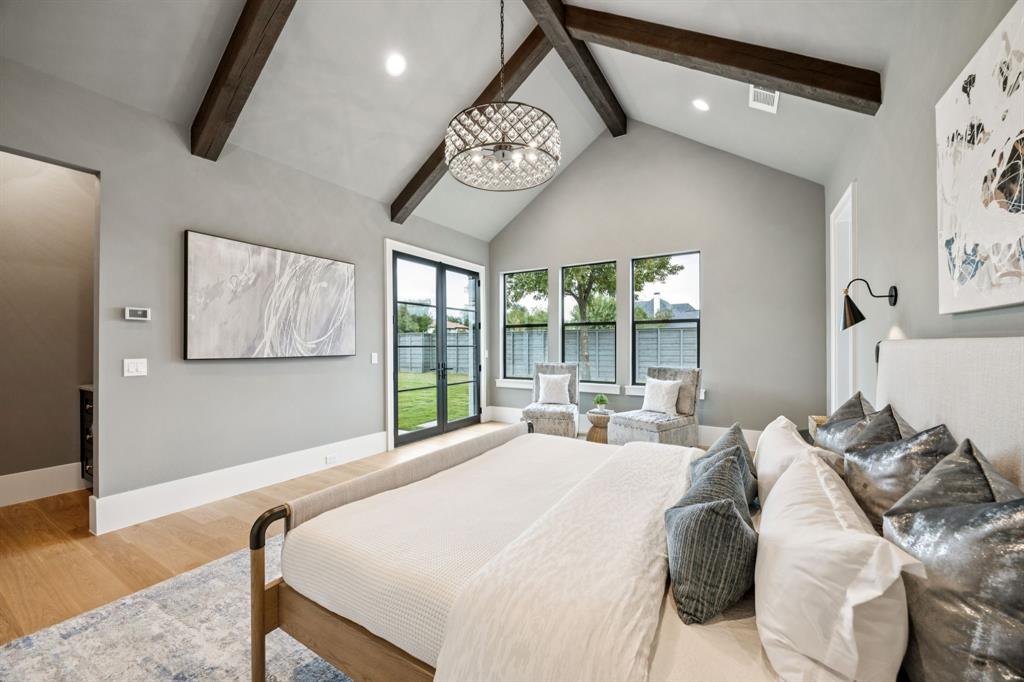 4330 Ridge Road Dallas, TX 75229 - Photo 16 of 30 a bedroom with a bed and a large window