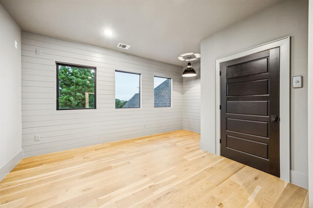 4330 Ridge Road Dallas, TX 75229 - Photo 21 of 30 a bedroom with a bed and a dresser