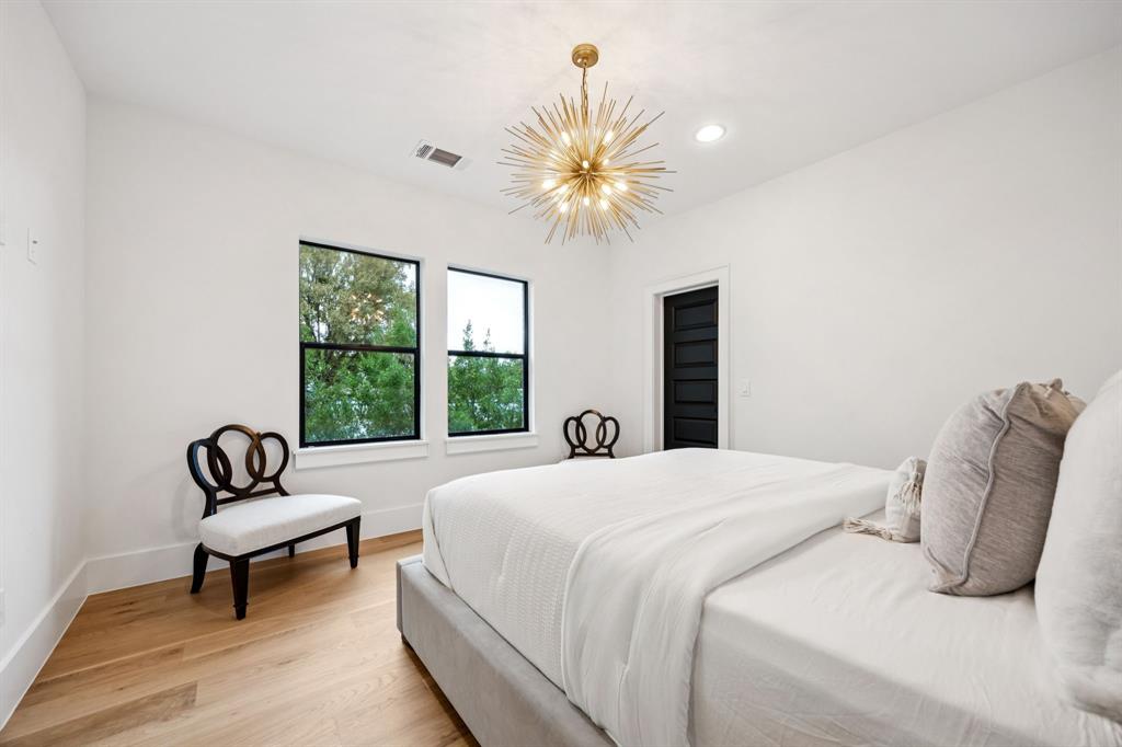 4330 Ridge Road Dallas, TX 75229 - Photo 24 of 30 a bedroom with a bed and a couch