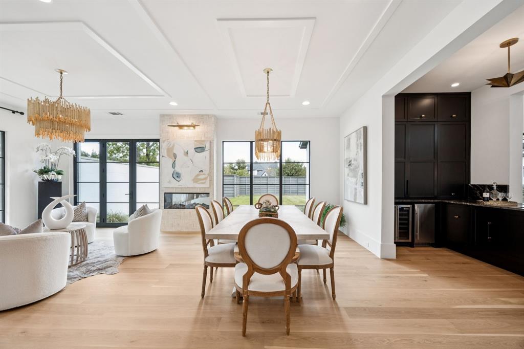 4330 Ridge Road Dallas, TX 75229 - Photo 7 of 30 a living room with furniture a chandelier and a large window