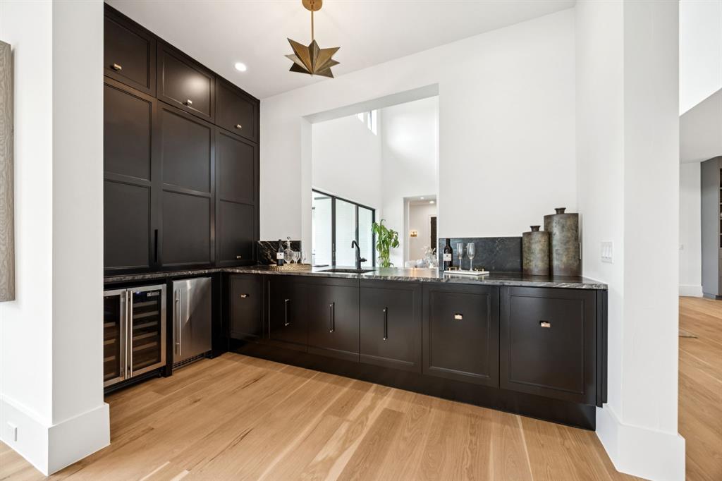 4330 Ridge Road Dallas, TX 75229 - Photo 8 of 30 a kitchen with stainless steel appliances granite countertop a refrigerator and stove
