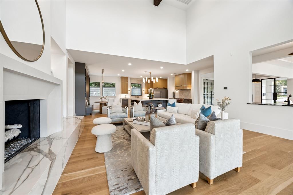 4330 Ridge Road Dallas, TX 75229 - Photo 9 of 30 a living room with furniture a fireplace and a potted plant